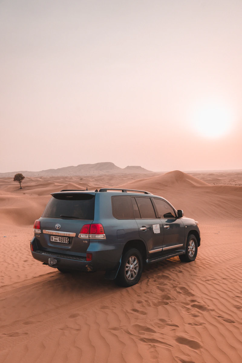 Open-top jeep on the desert sand