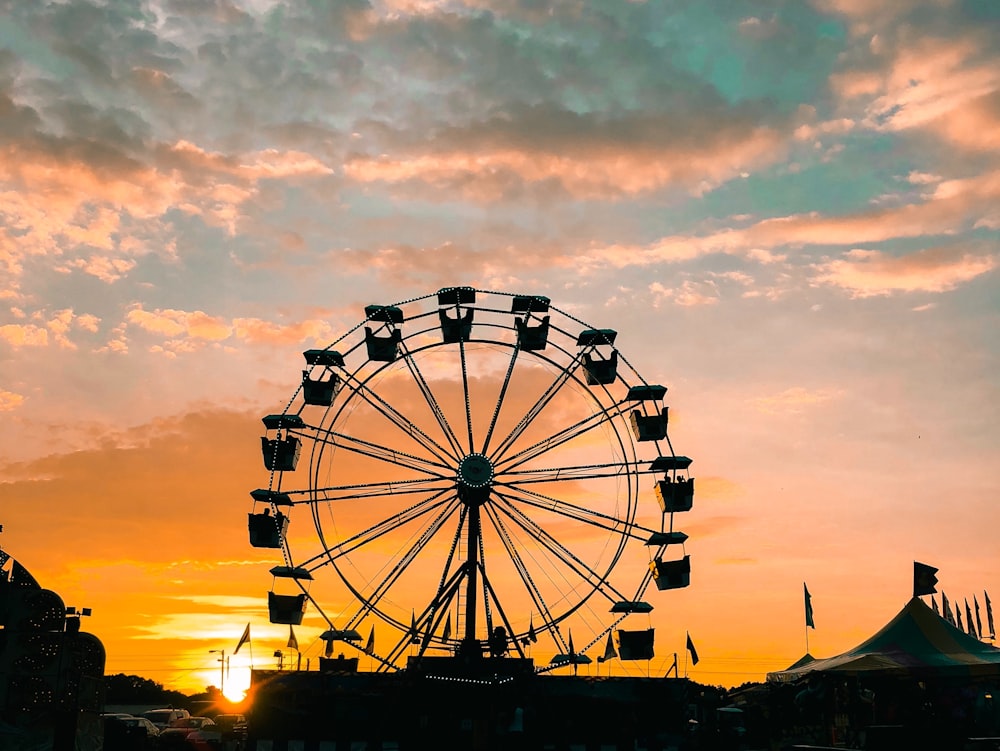 silhouette of fferrsi wheel during golden hour