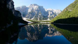 A serene mountain landscape under a clear blue sky, inviting peace.