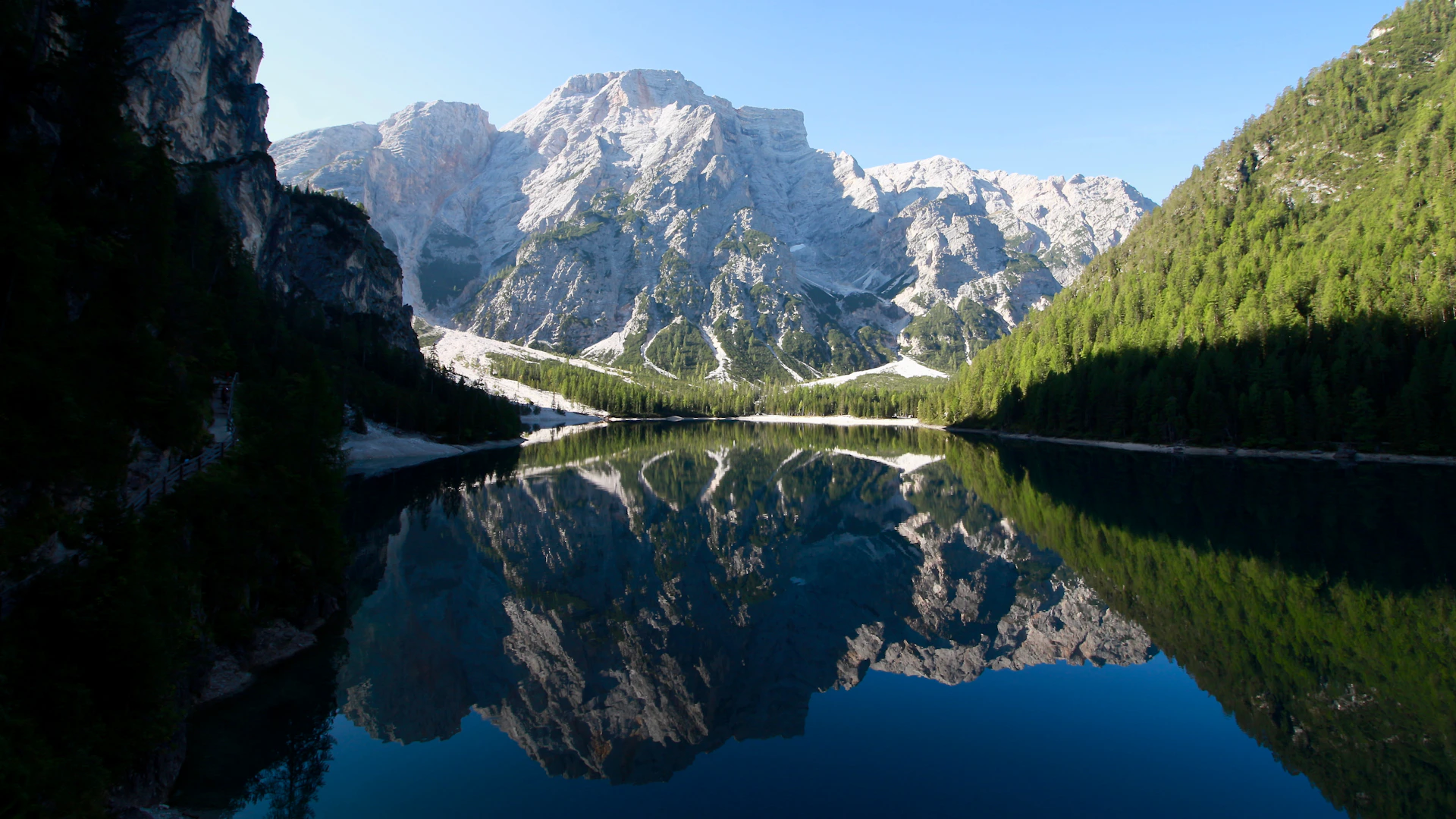 A serene mountain landscape under a clear blue sky, inviting calm and inspiration.
