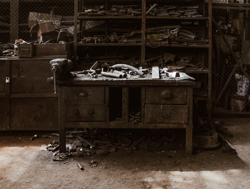 tools on desk beside sheld