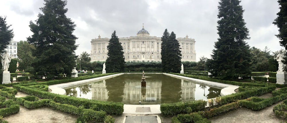 photography of fountain and building during daytime