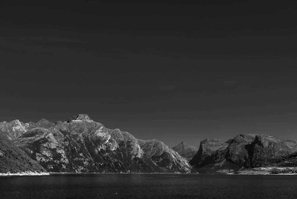 grayscale photography of mountain range