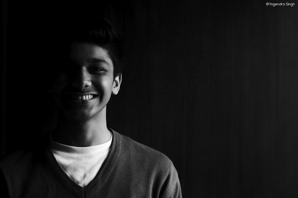 grayscale photography of man smiling