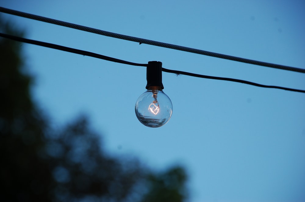 light bulb hanging on wire