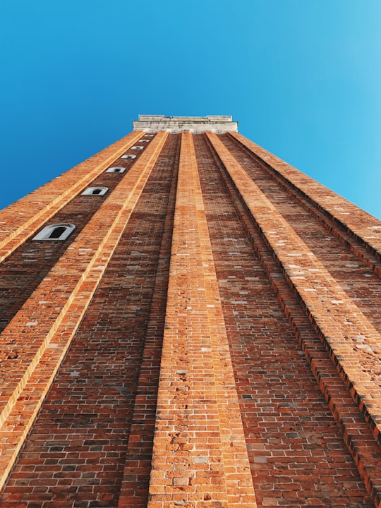 low angle photography of brown brick building under clear sky in Saint Mark's Basilica Italy