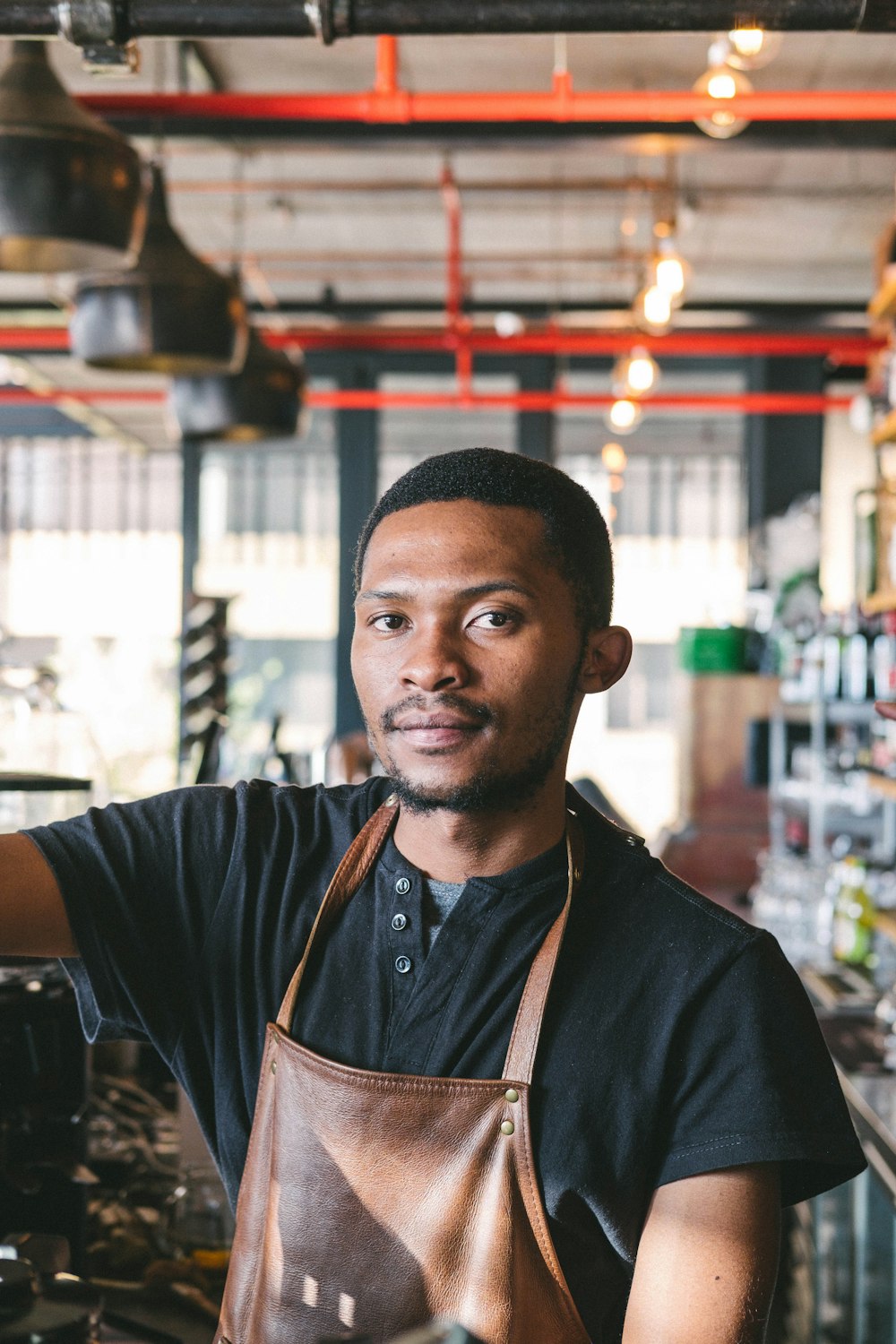 man wearing brown apron