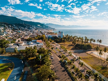Local athletes training outdoors with the Cali skyline in the background.