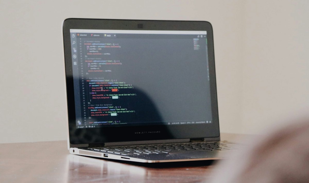 Laptop screen showing code used to connect sales tools, a core GTM engineer skill for Salesforce professionals