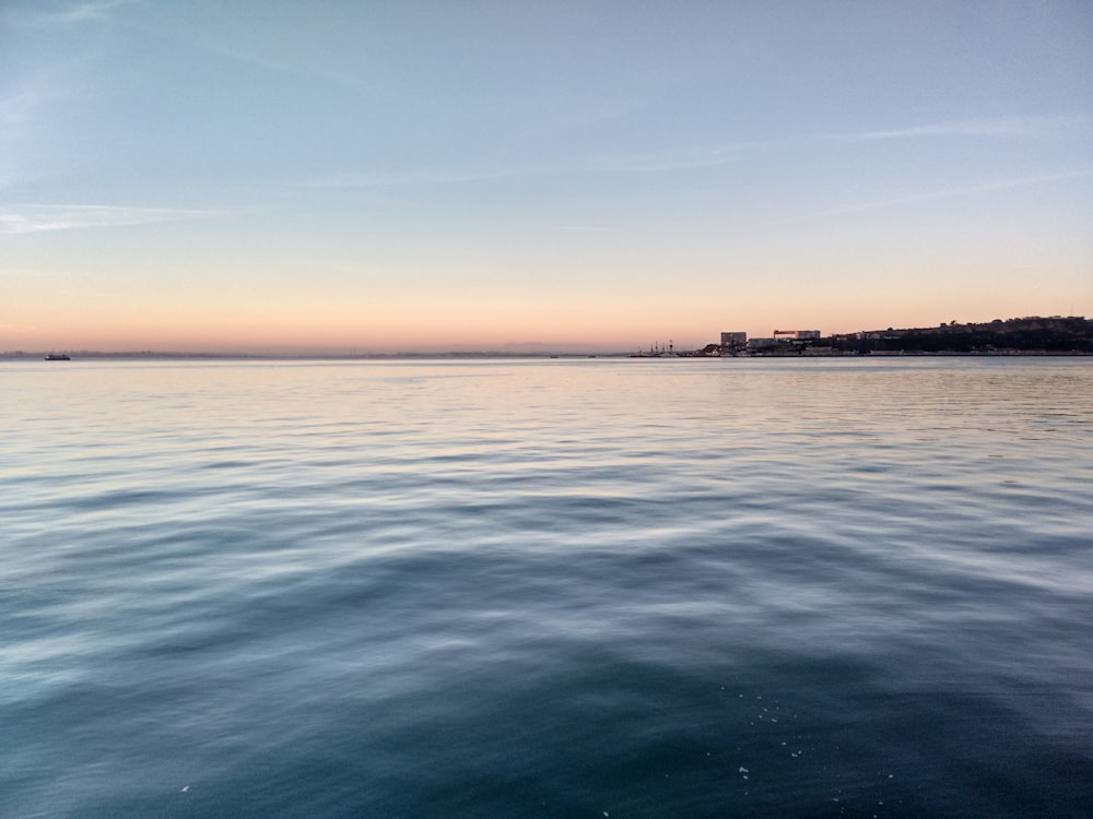 body of water during daytime photo