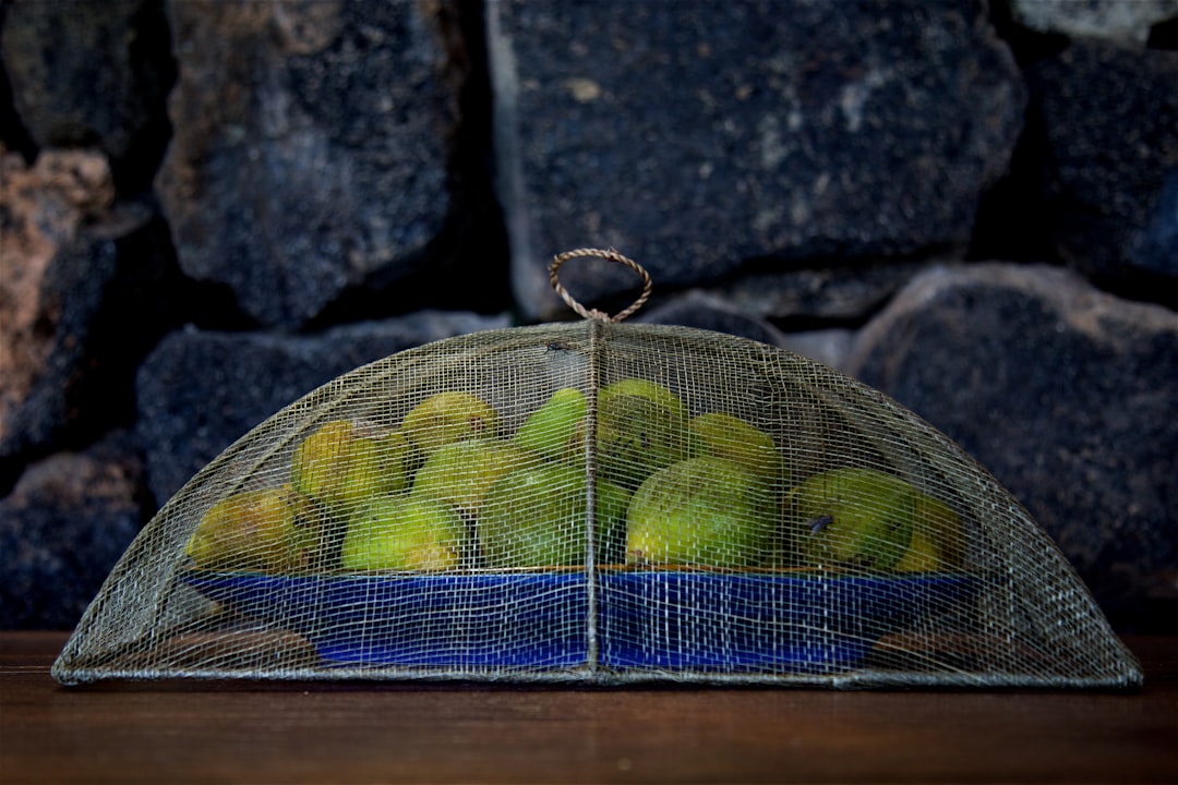 green fruits on blue plate