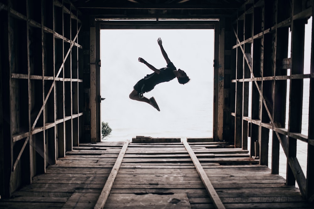 boy jumping on focus photography