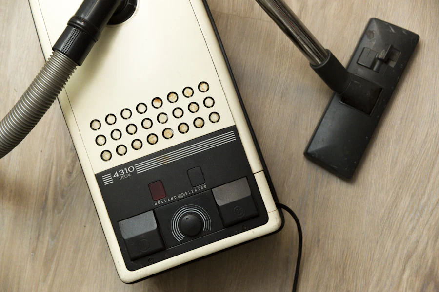 Black commercial vacuum cleaner on a wooden surface