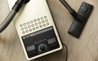 black vacuum cleaner on brown wooden surface