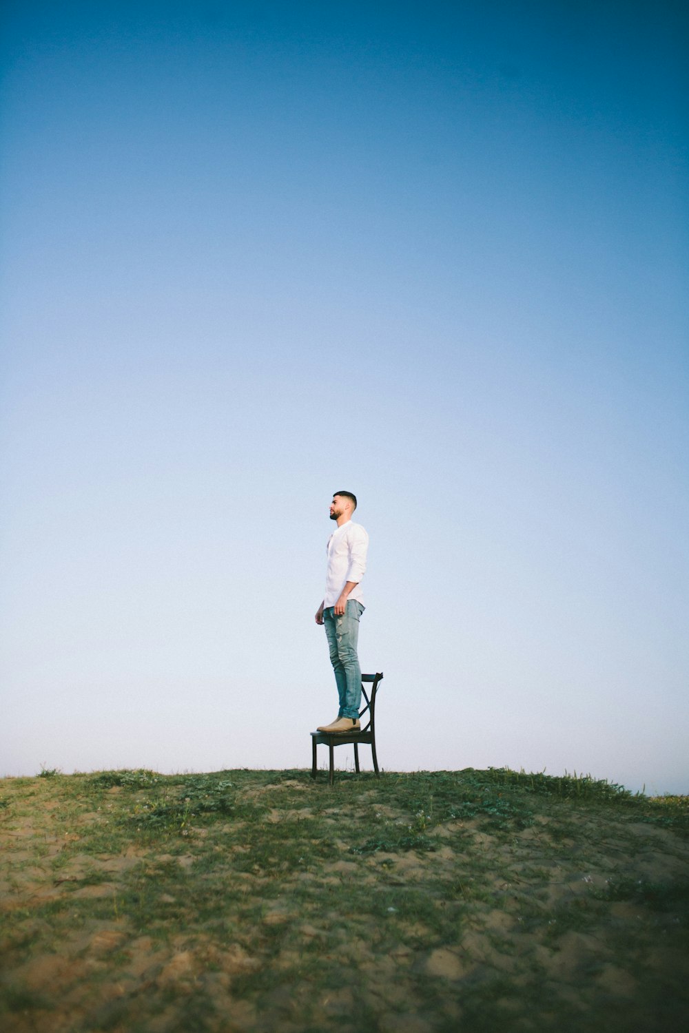 man standing on chair