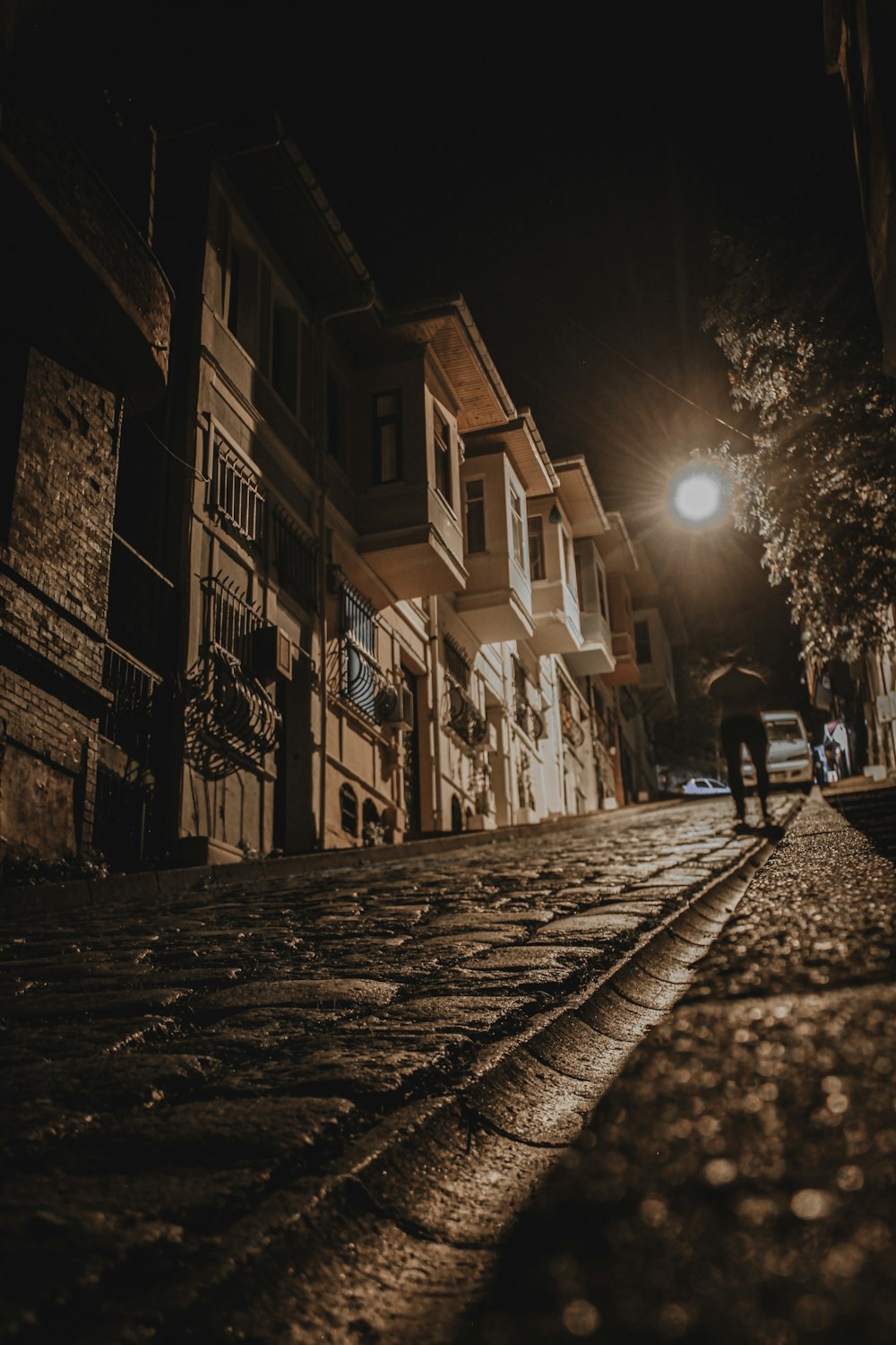 man walking along the street during nighttime