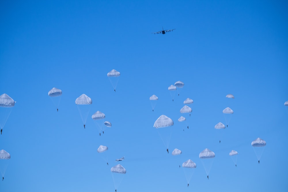 white parachutes during daytime photo