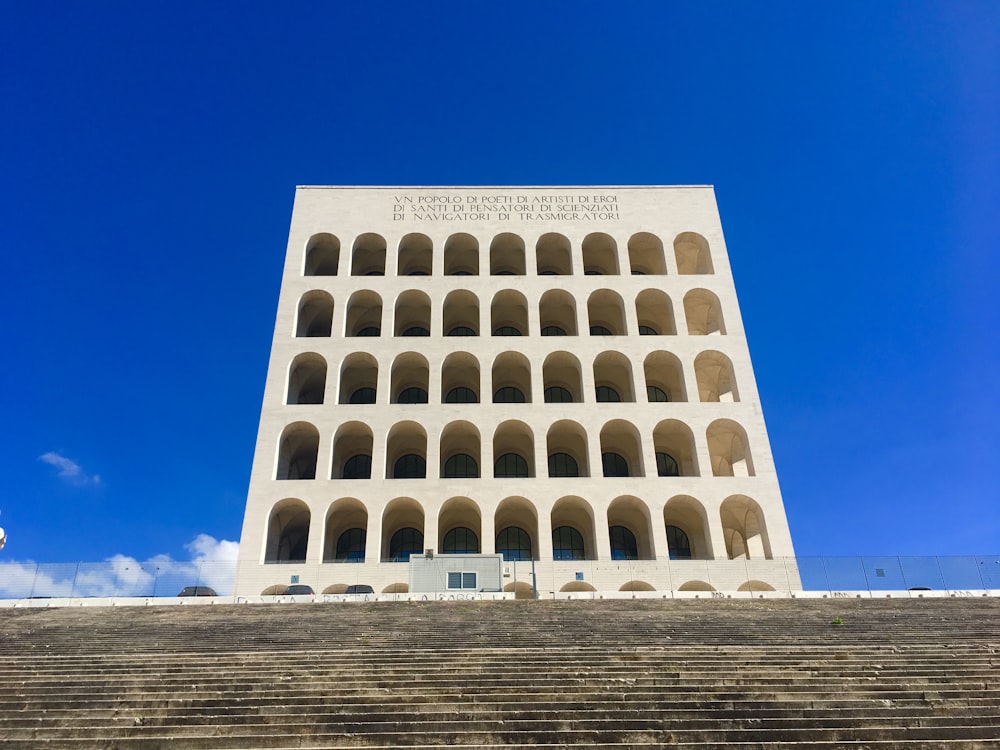 white building near stairs during day