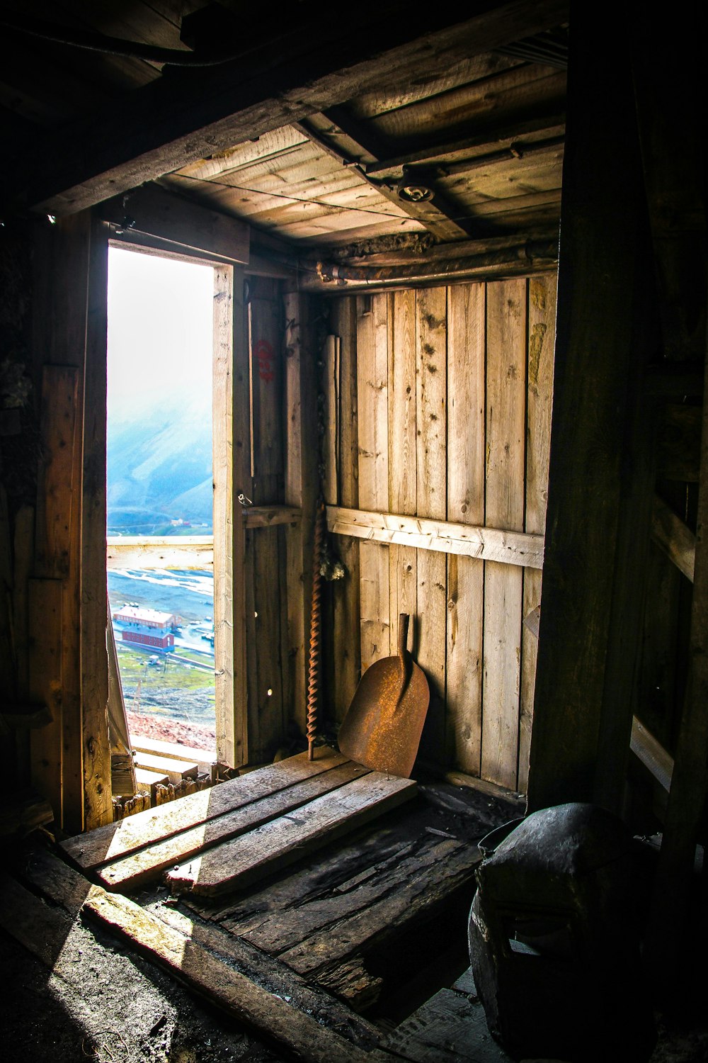 brown wooden shed showing open door