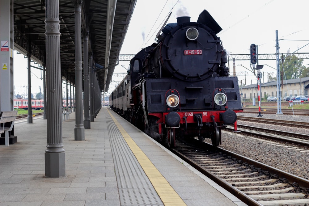 black train at station during daytime