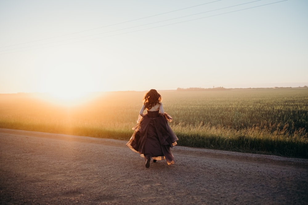 woman standing on road during daytime