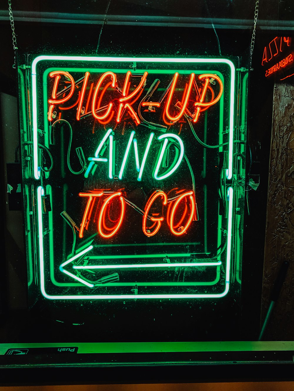 orange and green pick-up and to go neon signage