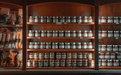 A bright, inviting display of various products arranged neatly on wooden shelves.