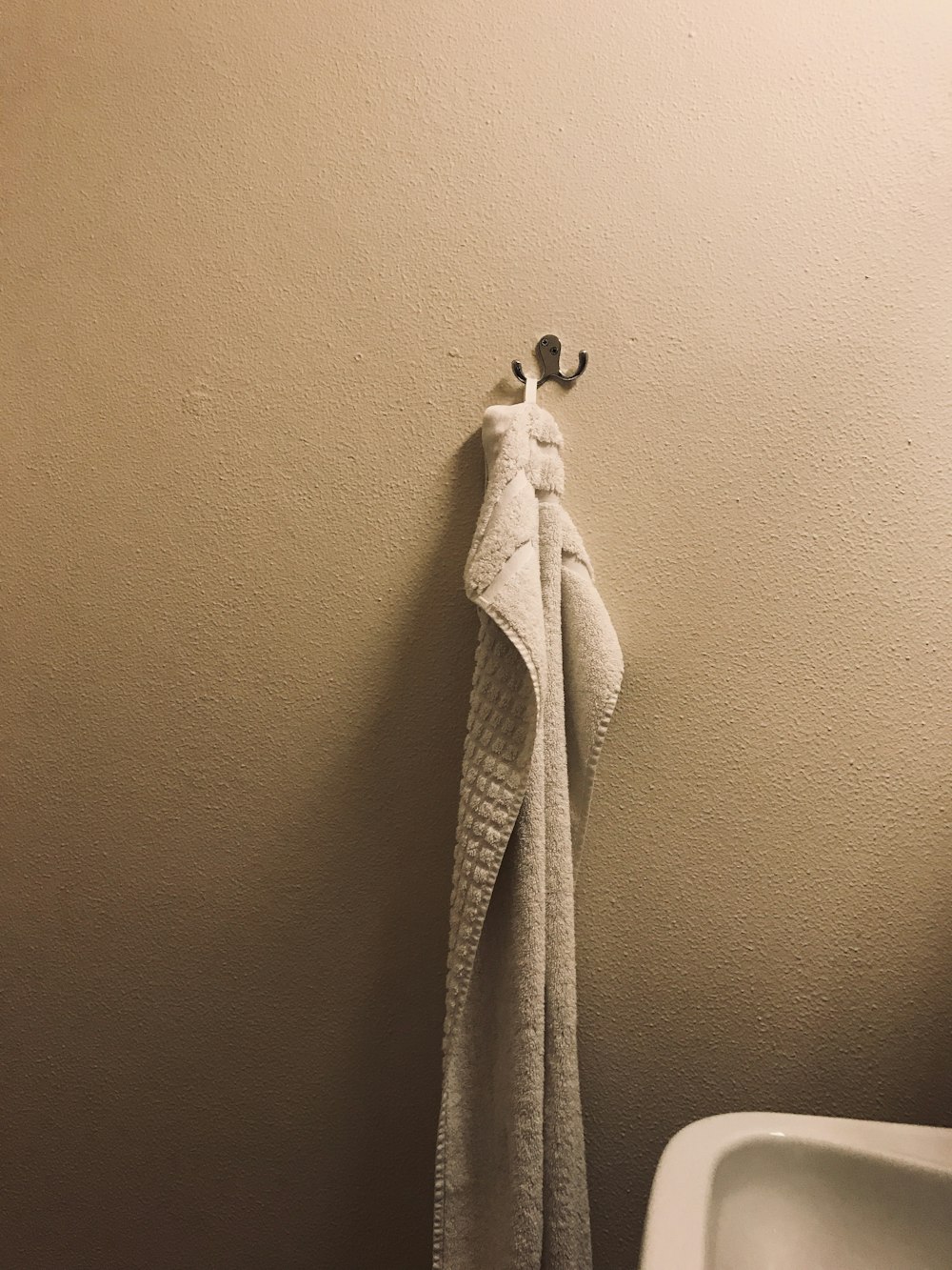 hung white towel