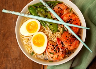 round white bowl with ramen and egg