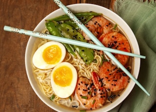 round white bowl with ramen and egg