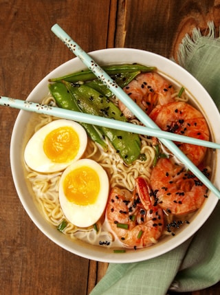 round white bowl with ramen and egg