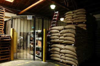a warehouse filled with lots of bags of sand