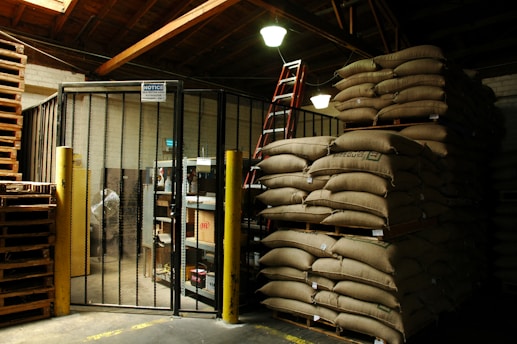 a warehouse filled with lots of bags of sand