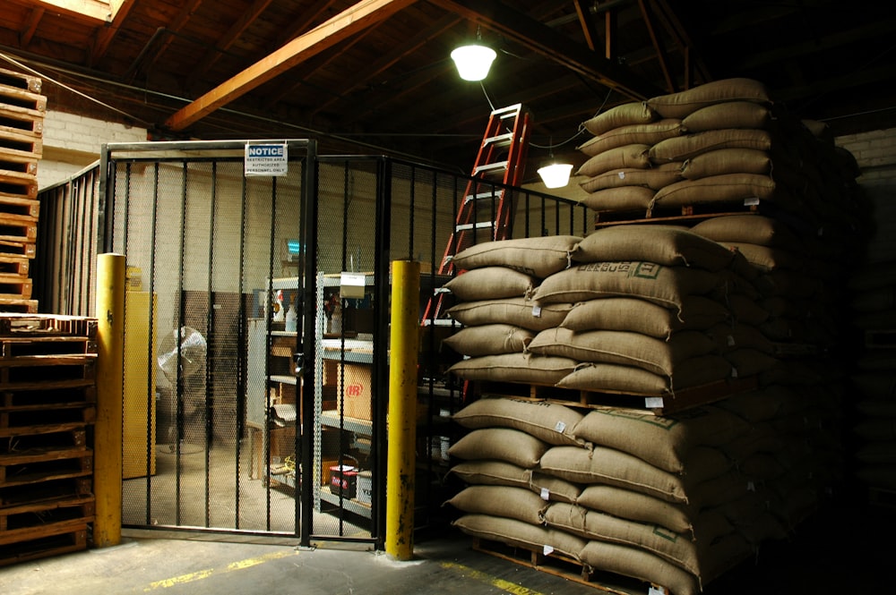 a warehouse filled with lots of bags of sand