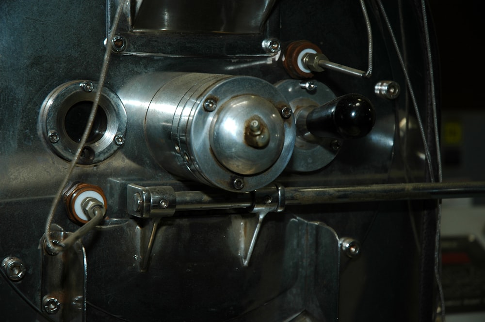a close up of a machine with a metal handle