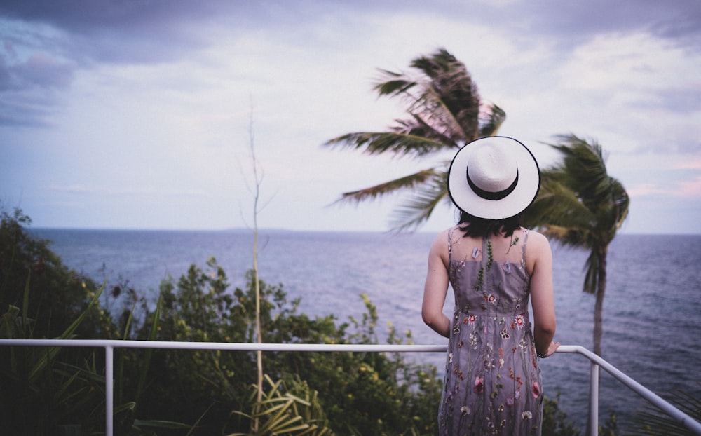 woman wearing grey and white spaghetti-strap dress screenshot