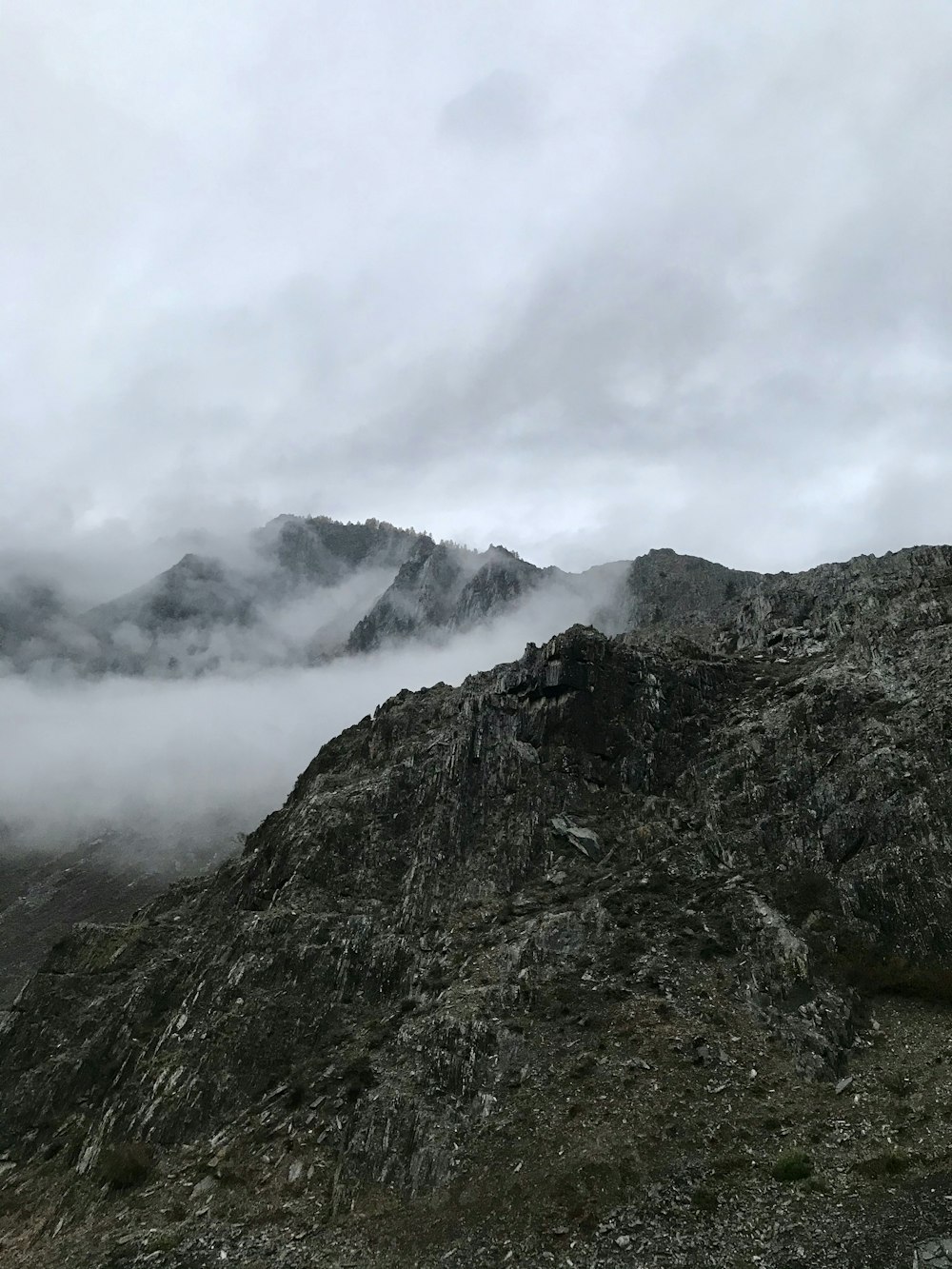 aerial photography of mountain covered with fogs