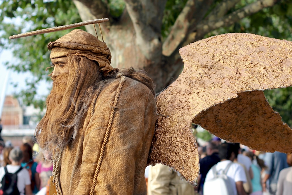 man with wings statue at daytime