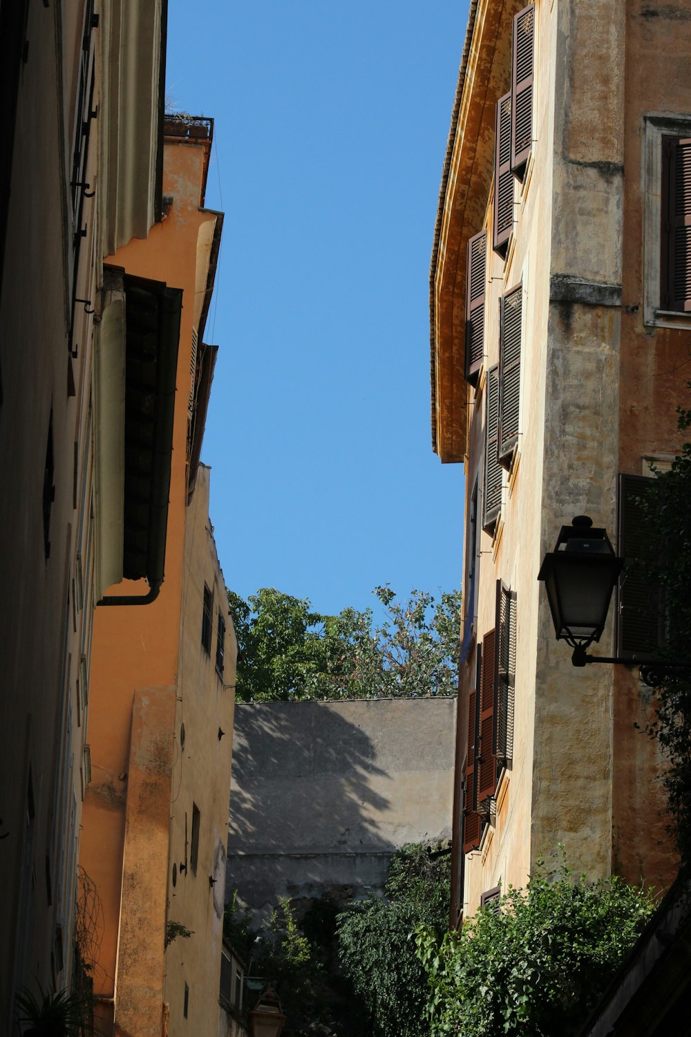 a view of a building from a narrow alley way