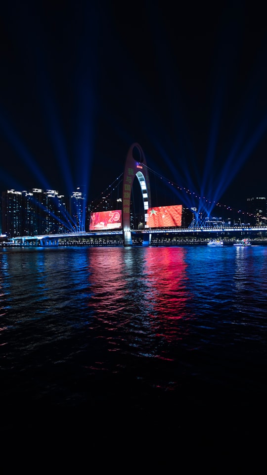 stage lights reflection on body of water at night in Liede Bridge China