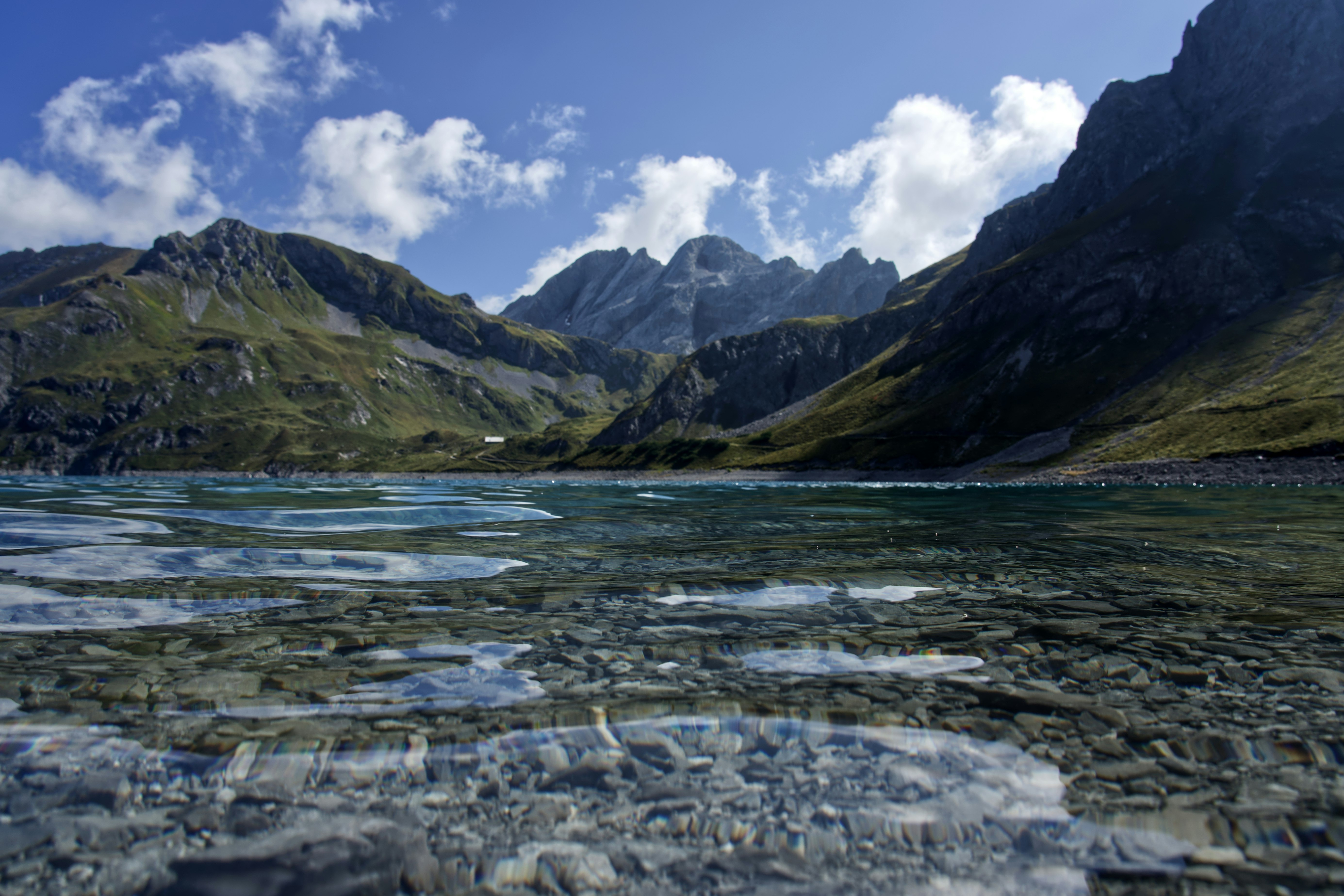 mountains under cloudy sky