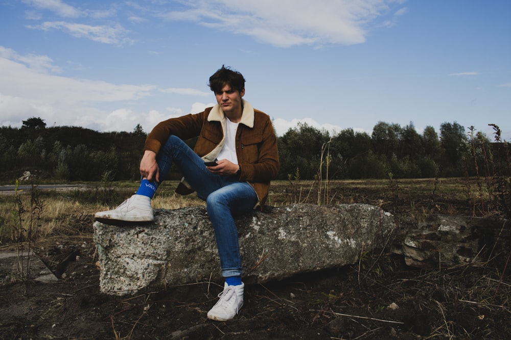 man siting on rock