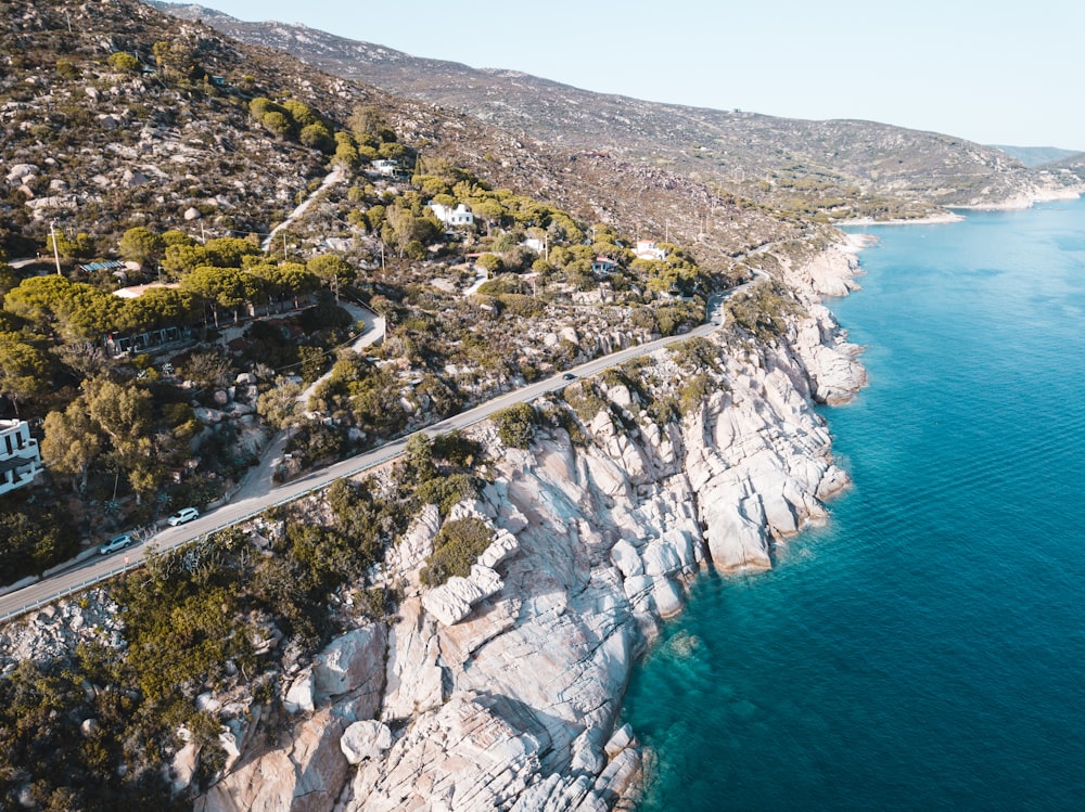 aerial photo of mountain near body of water during daytime