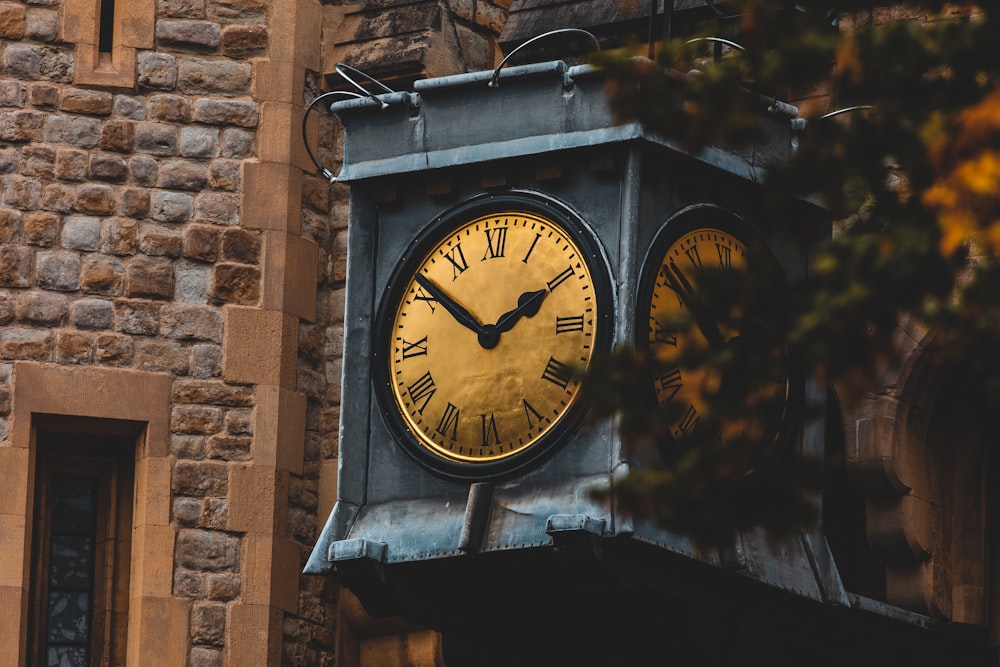 analog clock beside wall