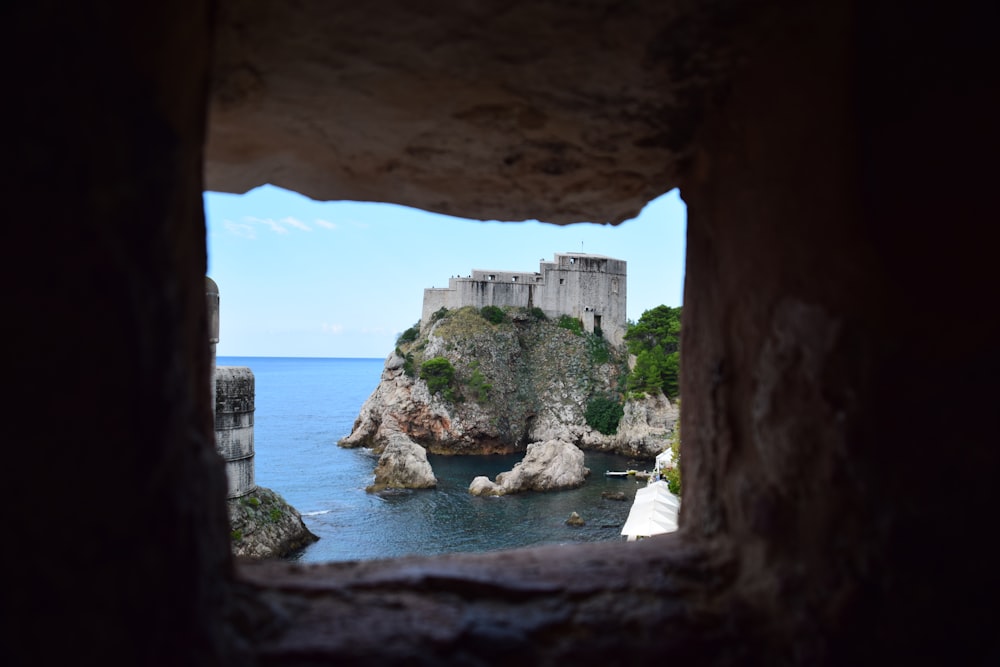 rock formation on the ocean photography