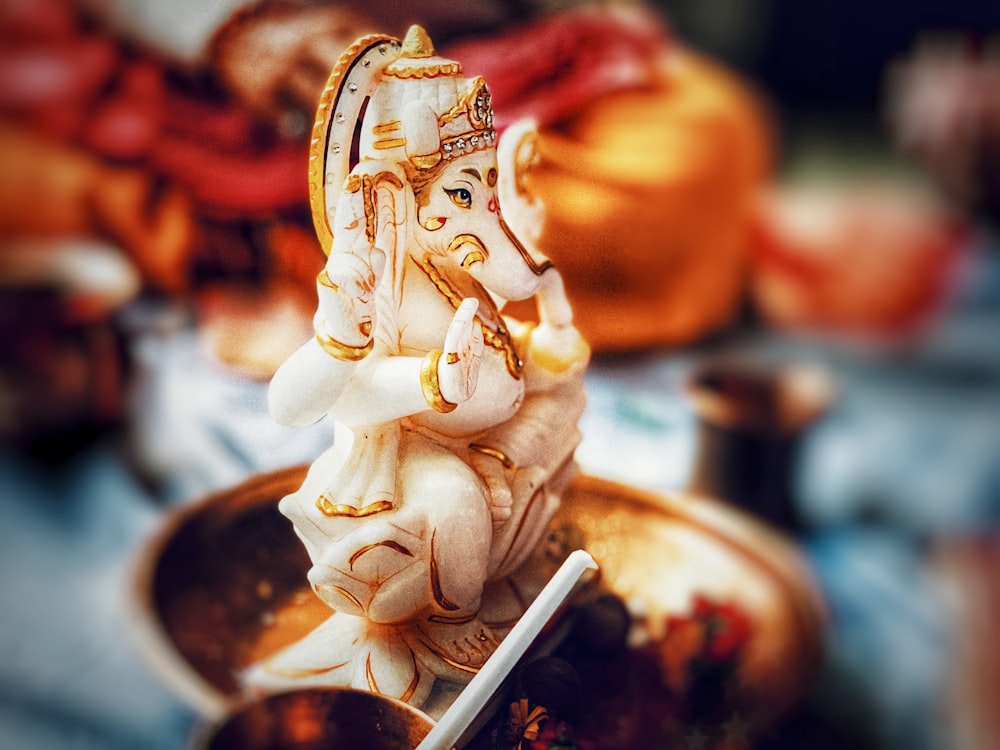 shallow focus photo of ceramic Ganesha Hindu god