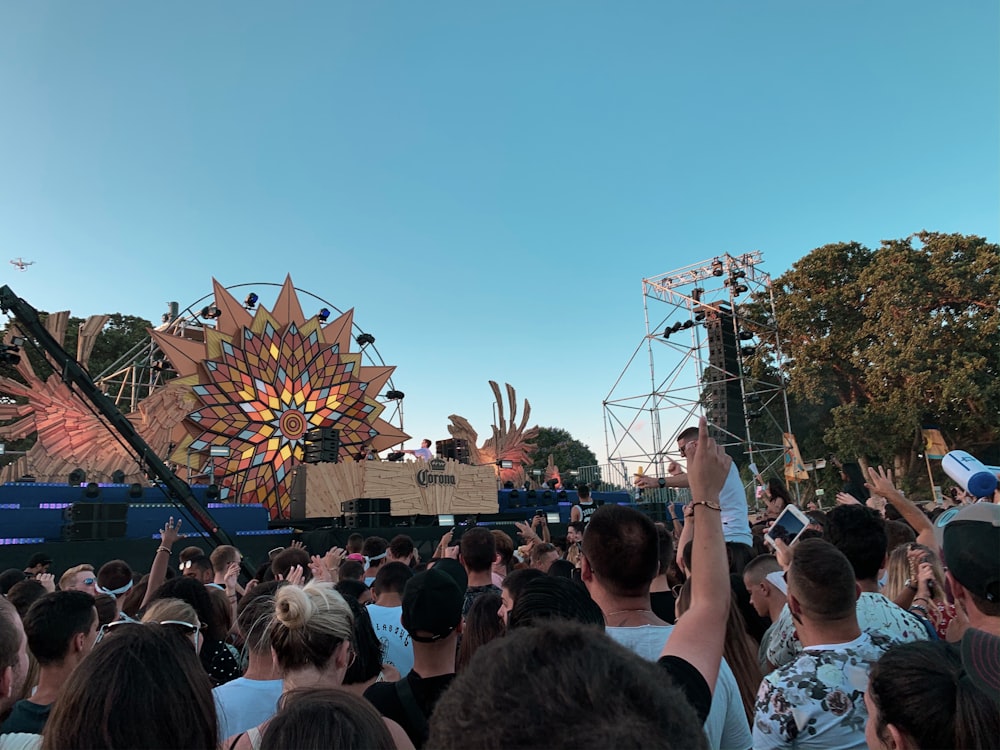 people near stage with metal frames