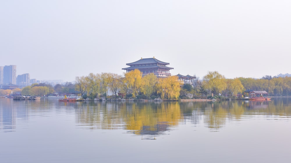 a large body of water with a building in the background