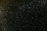 A panoramic view of the cosmos above Ebonyr, dotted with distant galaxies and nebulae.