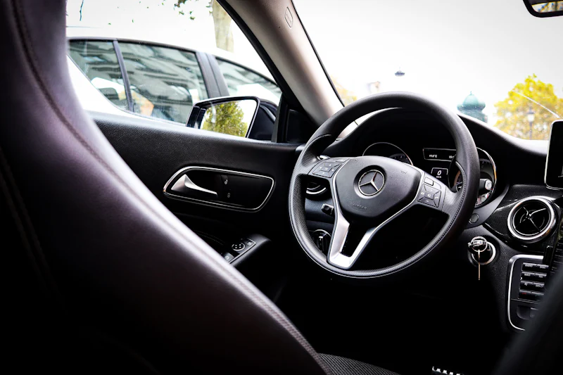 The interior and steering wheel of a Mercedes-Benz